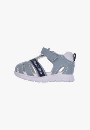 Light blue child’s sandal made of synthetic material, featuring a Velcro strap, white accents, and a textured sole for traction.