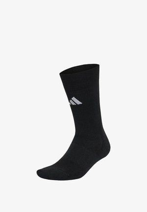 Czarna skarpeta typu crew z białym logo adidas po boku, prążkowana faktura, zaprojektowana do użytku sportowego.