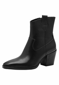 Botte de cheville noire en cuir avec un bout pointu, un talon bloc et des découpes sur les côtés. Elle dispose d'une fermeture zippée et de coutures texturées.