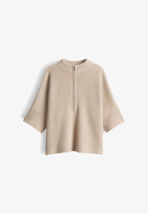 Beige gebreide trui met geribbelde textuur, halve ritssluiting aan de voorkant en korte, brede mouwen. Heeft een hoge hals en een losse, ontspannen pasvorm.