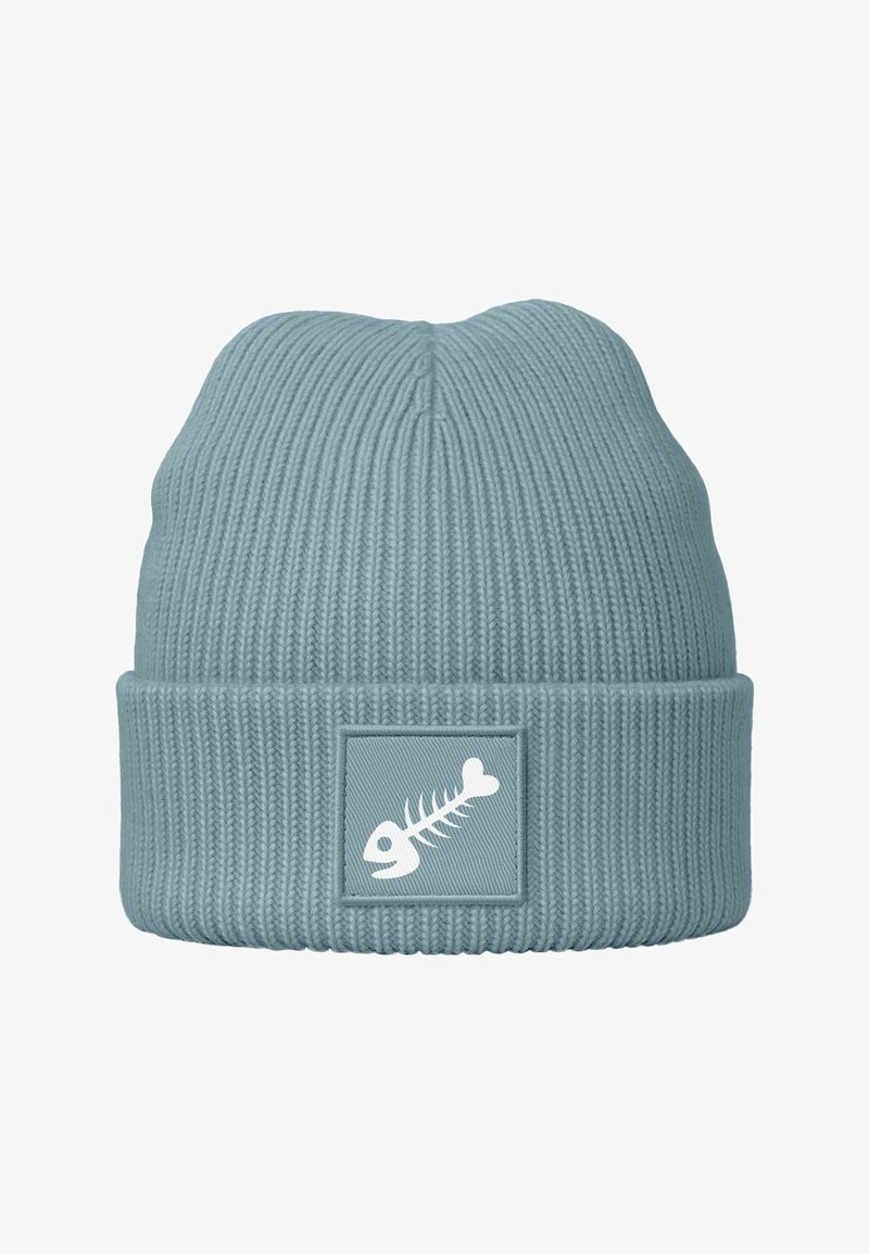 Knit beanie in soft light blue, featuring a ribbed texture and a rectangular patch with a white fishbone graphic.