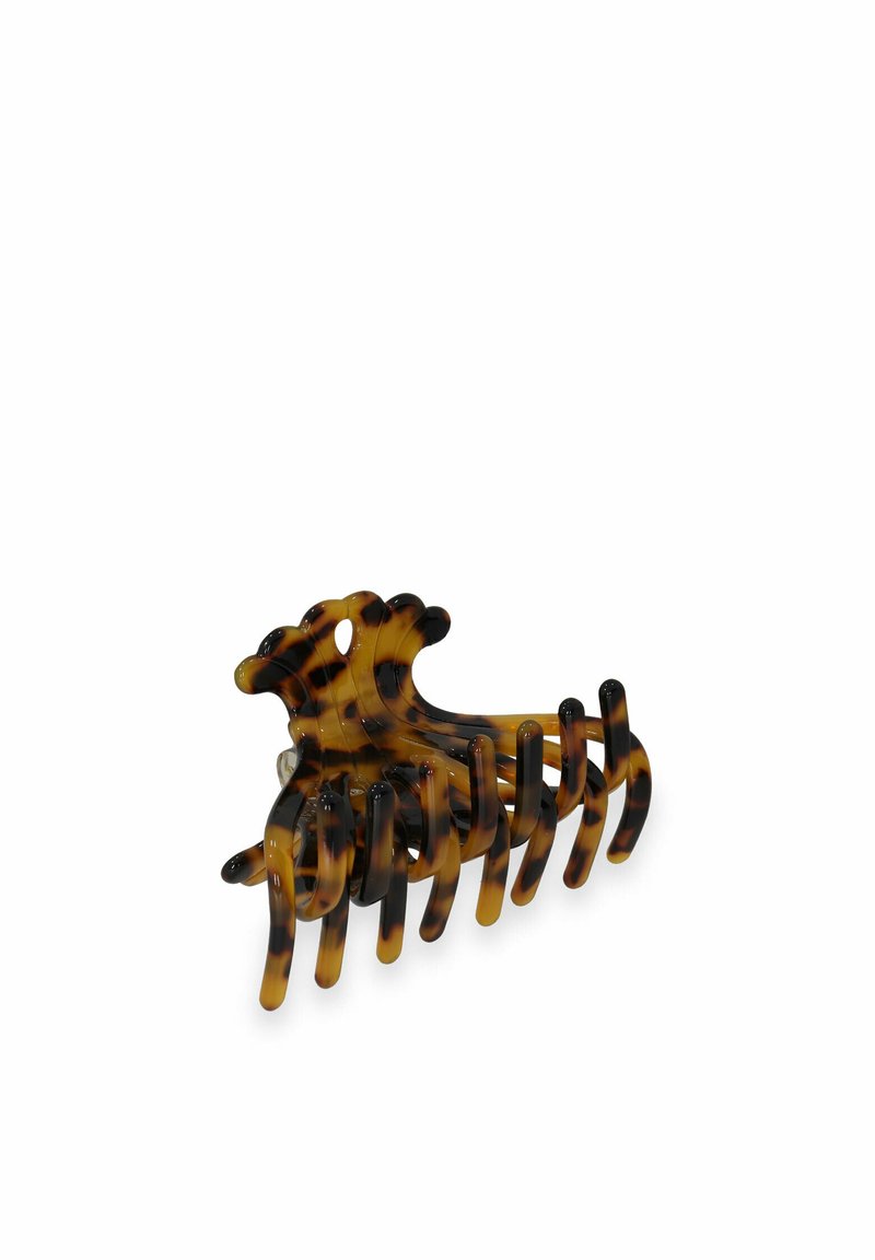 Fibbia per capelli in tartaruga realizzata in plastica, caratterizzata da denti ampi e un design arrotondato, con una finitura lucida e motivi alternati chiari e scuri.