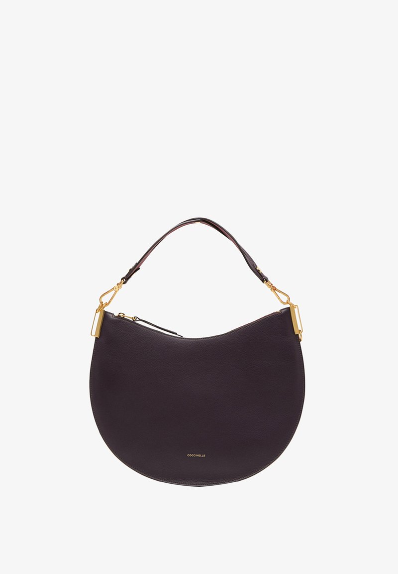 Leather handbag in dark purple with a crescent shape. Gold hardware accents, a curved handle, and a zipper closure. Brand name visible.