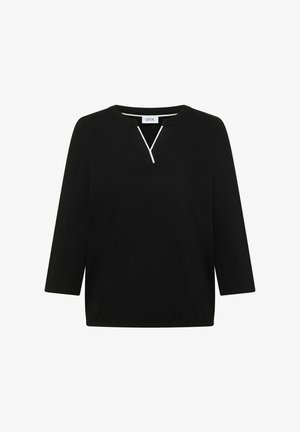 Haut noir à manches longues avec un col rond et une petite découpe en forme de V soulignée d'un liseré blanc au centre avant.
