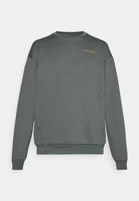 Sweatshirt gris texturé avec un motif en nid d'abeille, des poignets et un ourlet côtelés, et un petit logo sur le devant, à gauche de la poitrine.