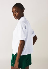 Champion WILD THINGS - Polo - white