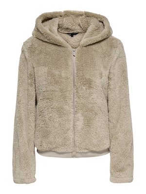 Beige zip-up hoodie made of soft, textured fleece. Features a hood, long sleeves, and ribbed hem and cuffs. No visible logos.