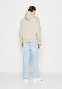 Calvin Klein HERO LOGO COMFORT HOODIE - Sportinis megztinis - london fog