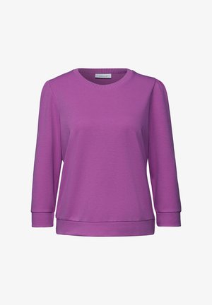 Sweatshirt violet à manches longues en tissu doux. Présente un col rond et des poignets côtelés avec une coupe décontractée. Fini lisse et texturé.