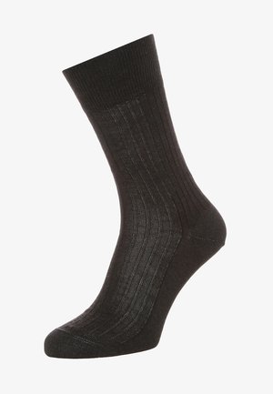 Schwarze gerippte Kniestrümpfe, aufrecht präsentiert, die Länge vom Knöchel bis zur Wade und das elastische Bunddetail zeigen.