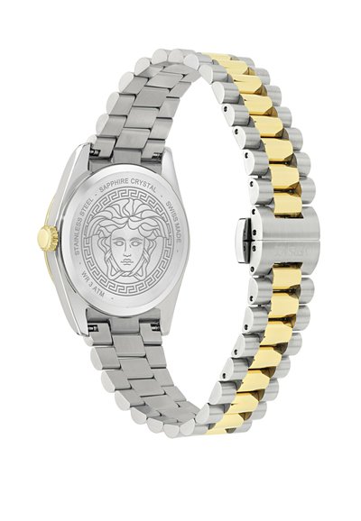 Nerūsējošā tērauda pulkstenis ar sudraba un zelta saišu aproci, apaļa korpuss, sapfeeru kristāls un iegravēts lauvu dizains uz korpusa aizmugures.