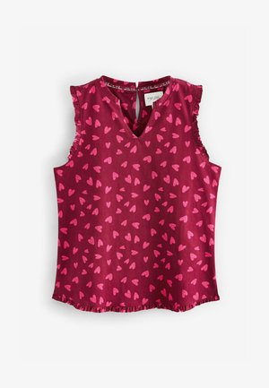 Top fără mâneci de culoare vișinie cu un model de inimioare roz, cu volane la umeri, decolteu în V și detaliu cu decupaj la spate. Material ușor, cu o textură fină.