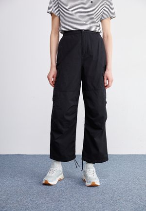 Reisitaskuhousut - black