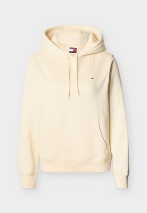 Kreemivärvi kapuutsiga pusa esitasku, reguleeritava nööriga kapuuts ja väike Tommy Jeansi logo rinnal.