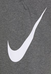 Nike Performance DRY TAPER - Pantalones deportivos - charcoal heather/white