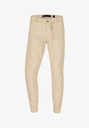 Beige jogger-lignende bukser lavet af tekstureret stof med elastisk manchet, knaplukning og diskrete sidelommer.