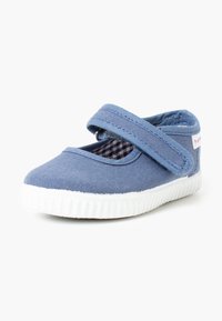 Sinine canvas Mary Jane jalanõud valge kummitaldadega ja Velcro rihmaga. Lisadetailiks on ruuduline vooder.