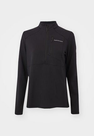 Black long-sleeve pullover made from textured material, featuring a half-zip, high collar, and a zippered chest pocket. Brand logo on front.