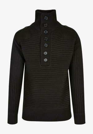 Melns adīts džemperis ar augstu apkakli, kuru rotā pogu rinda un plecu akcenti. Visā virsmā ir teksturēts raksts. Mīksta, silta auduma.