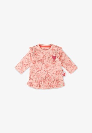Pink long-sleeve baby top with bird and flower patterns, ruffled hem, and two small heart-shaped patches on the chest and side.