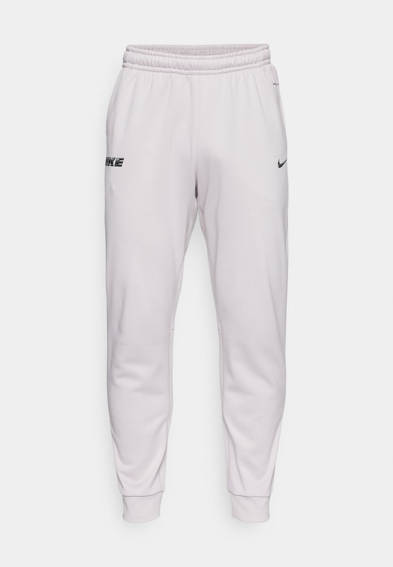 Joggers Nike gris clair avec une taille élastique, des jambes fuselées, des poches latérales et une marque imprimée sur la cuisse gauche. Texture douce et lisse.