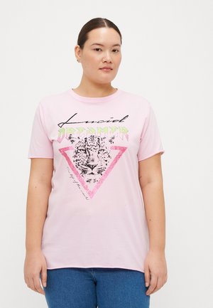 Light pink short-sleeve t-shirt featuring a leopard graphic in black and pink glitter within a triangular design, with "Lucid Dreamer" text above.