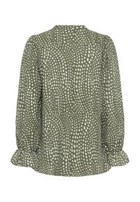 Grøn bluse med lange ærmer, hvidt uregelmæssigt prikkemønster, puffede ærmer og flæsekantede manchetter, set bagfra.