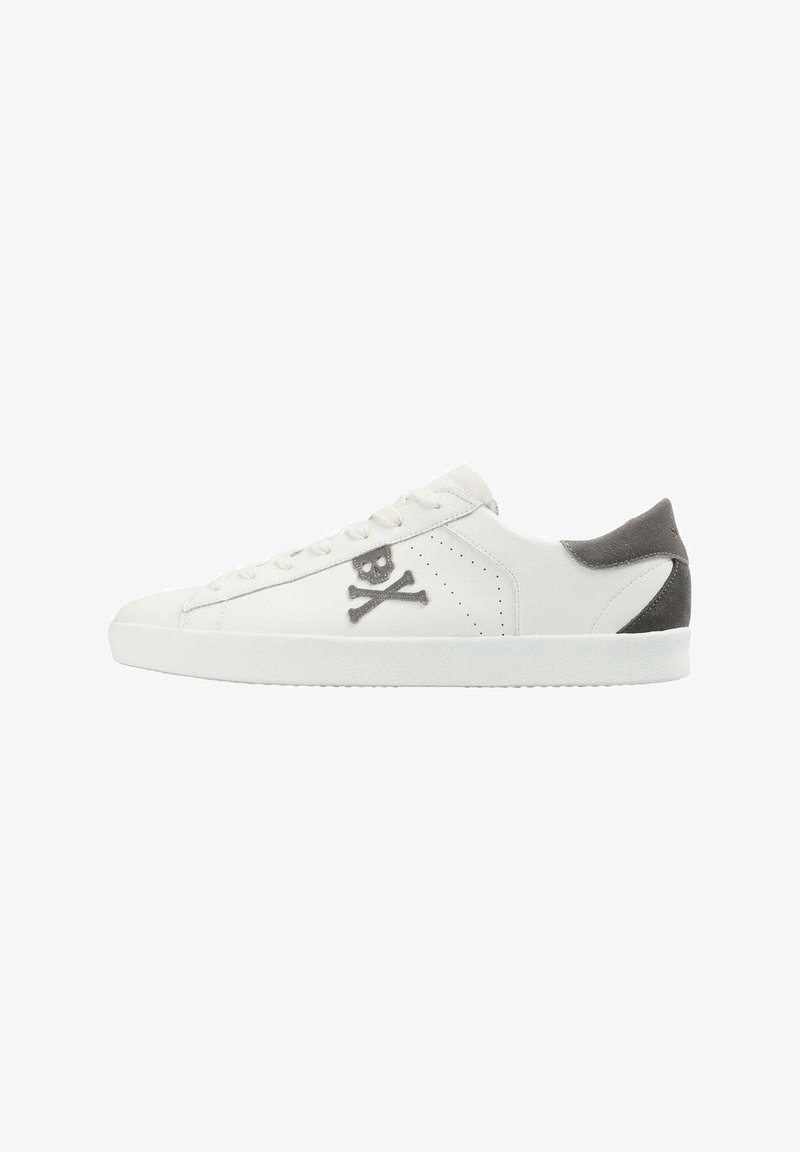 White leather sneakers featuring a skull and crossbones logo, grey suede heel accents, flat laces, and a textured rubber sole.