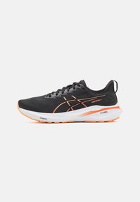 Black running shoe with orange accents, mesh upper, rounded toe, and cushioned sole featuring "FF Blast+" and "PureGEL" branding.