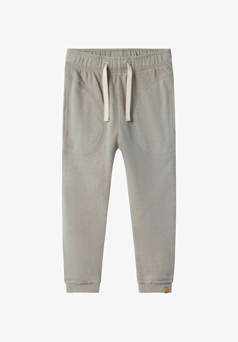 Light gray sweatpants with a stretchy waistband, beige drawstrings, and curved pockets. Features ribbed cuffs and a small logo on the leg.