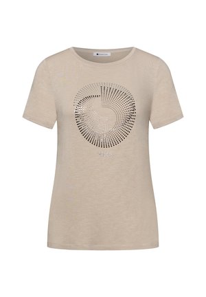 T-shirt beige à manches courtes avec encolure ronde, présentant un motif circulaire en pointillés et le mot "SOLEIL" en petites lettres en dessous.