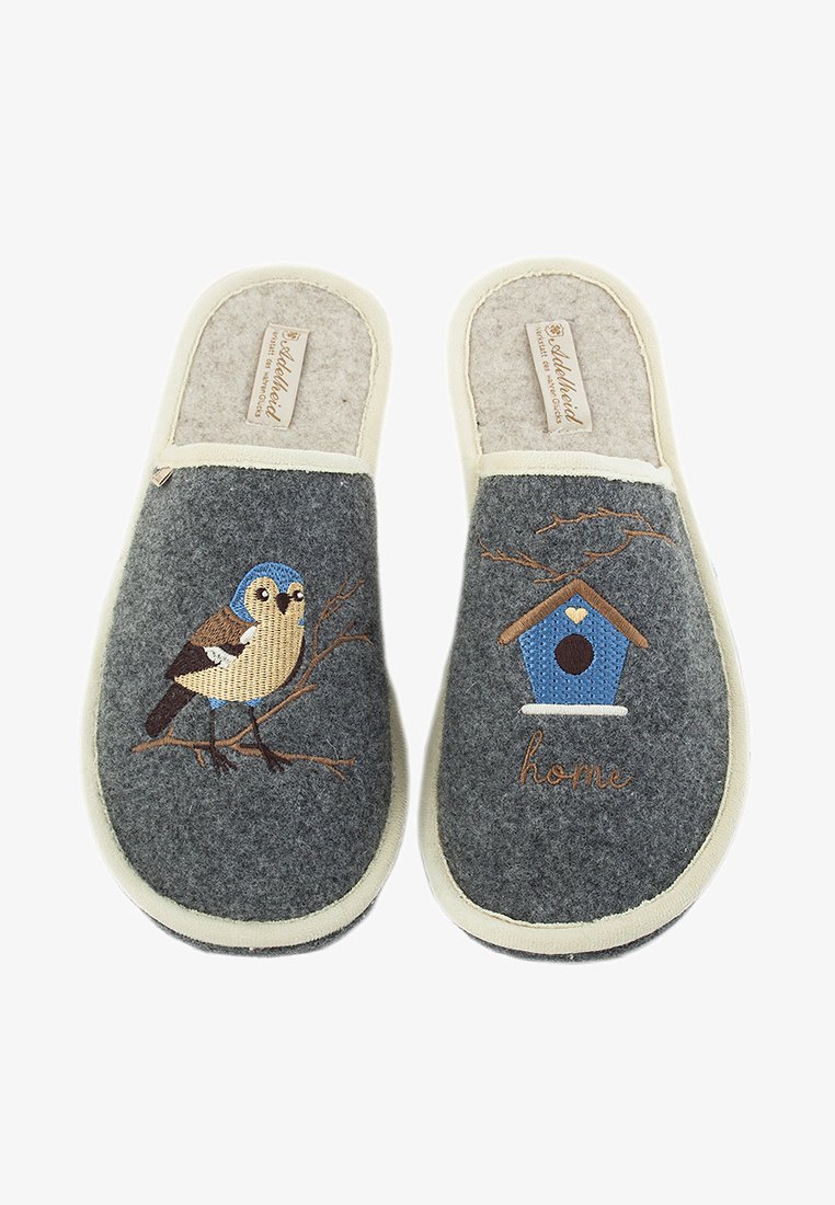 Gray felt slippers with cream lining, featuring embroidered bird and birdhouse designs with the word "home" in brown. Soft, cozy texture.