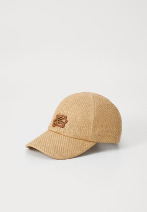 Tan woven baseball cap with a textured finish, featuring a brown logo accent on the front. Curved brim and structured design.