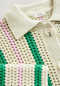 Knit cardigan featuring cream base with green and pink stripes, textured fabric, ribbed collar, and a round, glossy button.
