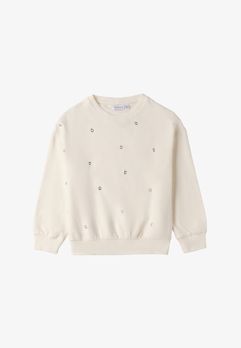 Sweatshirt de couleur crème avec des manches longues et froncées et un ourlet côtelé. Il arbore des embellissements en argent éparpillés sur le devant.