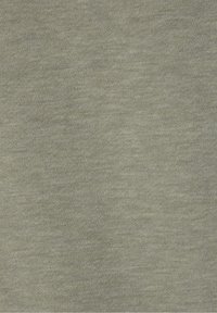 Texture de tissu tricoté vert olive uni avec un motif de tissage doux et uniforme.