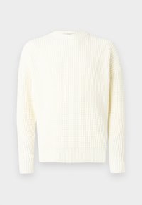 Vohvelineulospusero off-white-värissä, pyöreä pääntie, resorit hihansuissa ja helmassa. Pehmeä pinta, rento istuvuus, pitkät hihat.