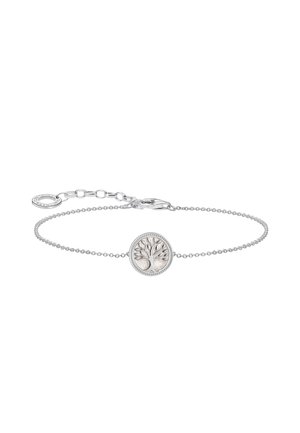 Delicate silver chain bracelet featuring a round charm with a raised tree design and a lobster clasp with adjustable links.