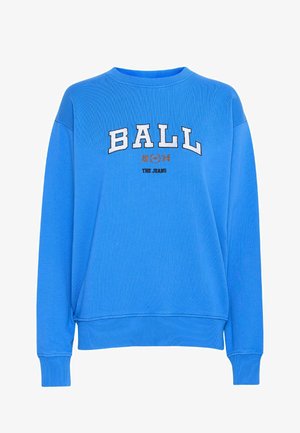 Zils džemperis ar apaļu kakla izgriezumu, uz kura ir izšuvums "BALL 1974" baltā un oranžā krāsā. Ribotie aproces un apakša, gluda auduma tekstūra.