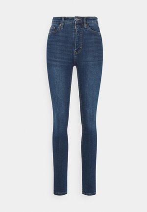 High-waisted dark blue skinny jeans with front button and zip closure, front and back pockets, and subtle fading on thighs.