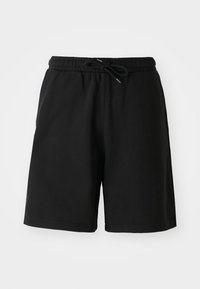 Pantalones cortos de algodón negros con cintura elástica, cierre con cordón y bolsillos laterales. Textura suave, diseño hasta la rodilla.