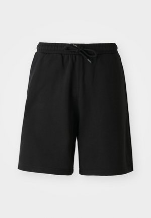 Mustadest puuvillast lühikesed püksid elastse vöökoha, nöörkinnise ja küljetaskutega. Sile tekstuur, põlvini ulatuv disain.