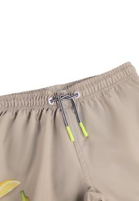 Costume da bagno beige con cintura elastica, dotato di un cordoncino con dettagli neri, bianchi e giallo brillante e grafiche di frutta.