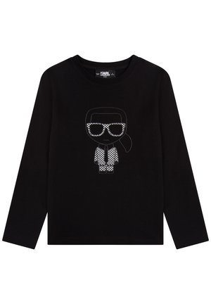 Camicia nera a maniche lunghe con grafica di un personaggio con occhiali da sole e completo decorato con ricamo bianco sul davanti.