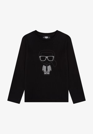 Czarna koszula z długim rękawem z grafiką postaci w okularach przeciwsłonecznych i wzorzystym garniturze, wyszywaną na biało z przodu.