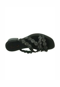 Black sandal featuring floral embroidery on straps, a smooth texture, and a low block heel. The sole is flat and slightly contoured.
