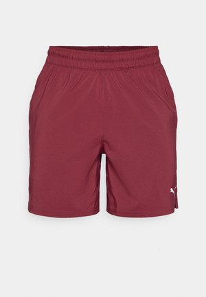 Pantaloni sportivi bordeaux con cintura elastica, tasche laterali e un piccolo logo bianco sul lato destro in basso. Tessuto dalla texture liscia.