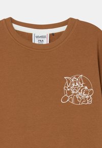 Felpa marrone con scollo a girocollo caratterizzata da una grafica con contorni bianchi di personaggi dei cartoni animati. Tessuto morbido con collo e orlo a costine.