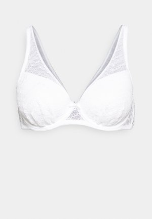 Baltas nėrinių liemenėlė trikampio formos, su tekstūruota medžiaga ir permatomais elementais šonuose. Minkšta apatinė juostelė patogumui.