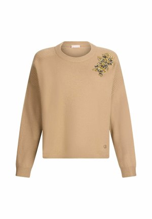 Beżowy sweter z dzianiny, z długimi rękawami, okrągłym dekoltem, ściągaczami przy mankietach oraz ozdobnym kwiatowym wzorem na lewym ramieniu.